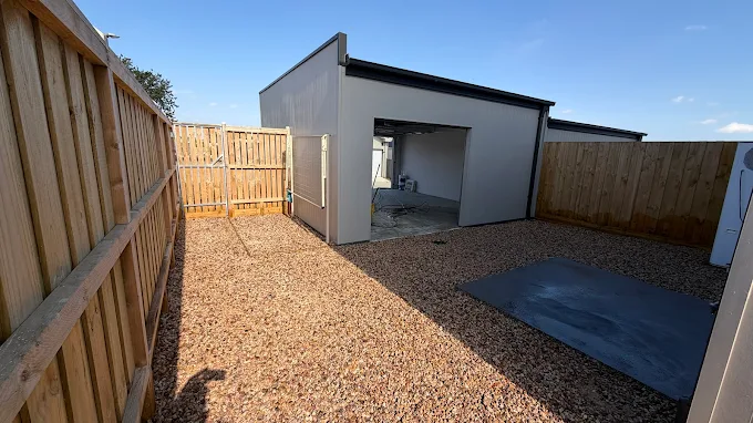 Backyard after being cleared and finished with gravel